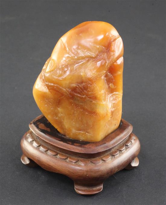 A Chinese Tianhuang stone landscape carving, 136g., 7 x 4 x 3.5cm, wood stand